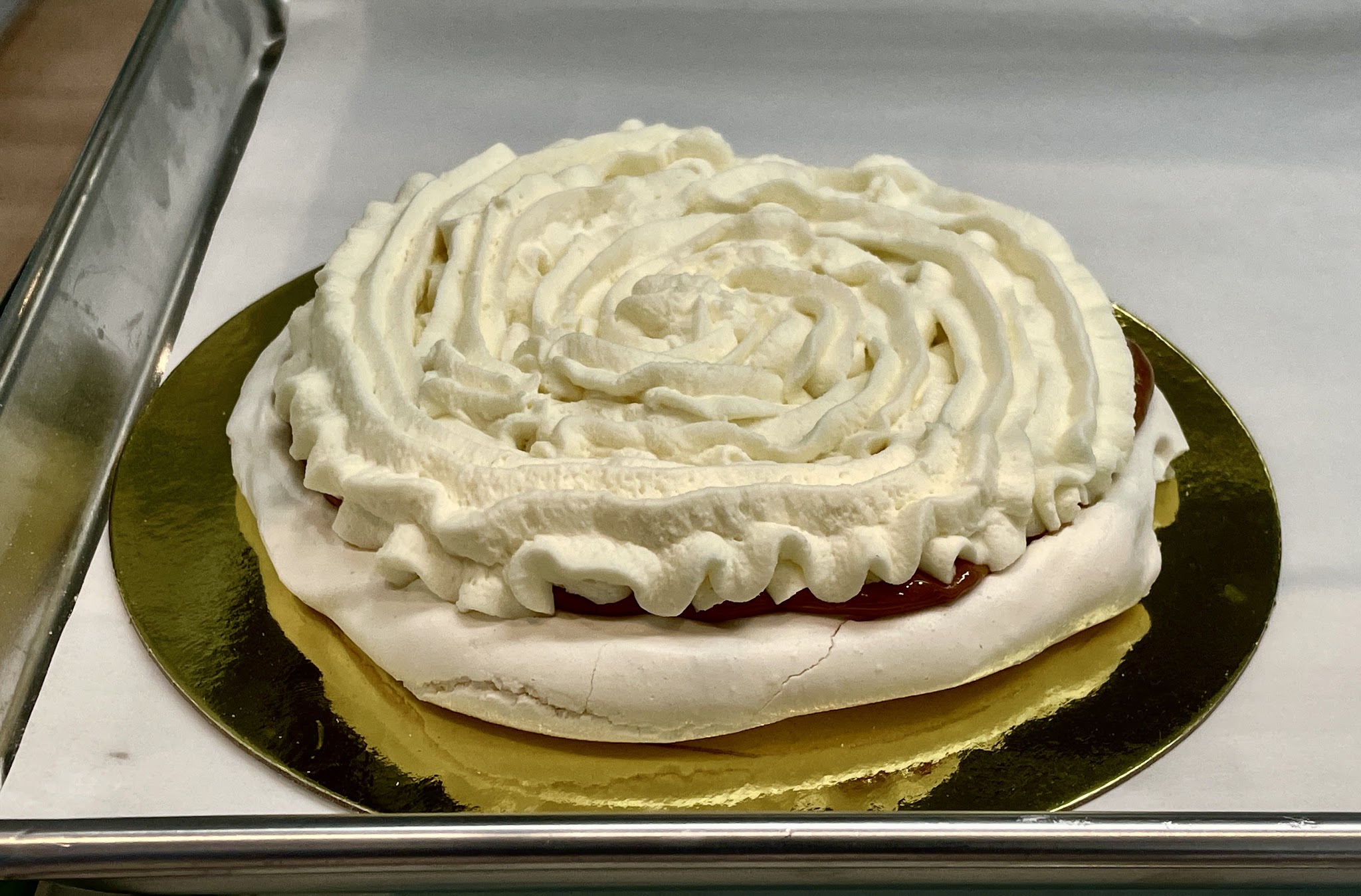 Tres Leches cake with swirled whipped cream frosting
